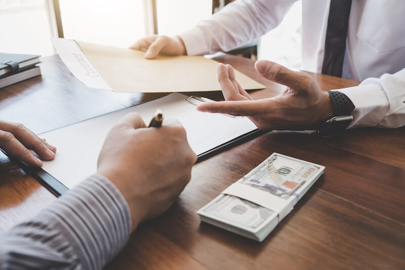 bigstock-Business-Signing-A-Contract-Bu-262469245
